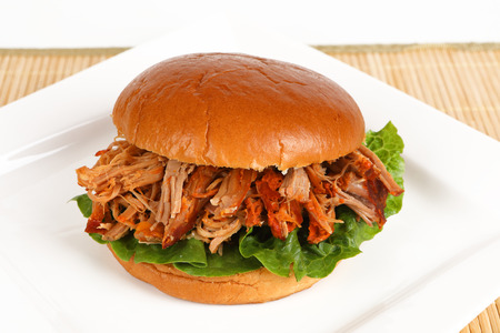 A burger with pulled pork on a plateの写真素材