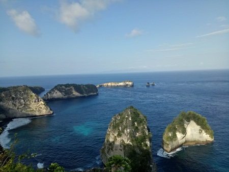 A small rocky islands across the shoreの写真素材