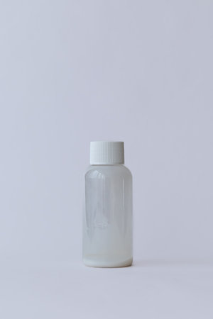 Transparent cosmetic container on a clean white background. Concept of skincare, beauty, and hygiene.の写真素材