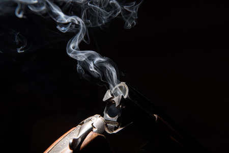 Smoke from a hunting rifle after firingの写真素材