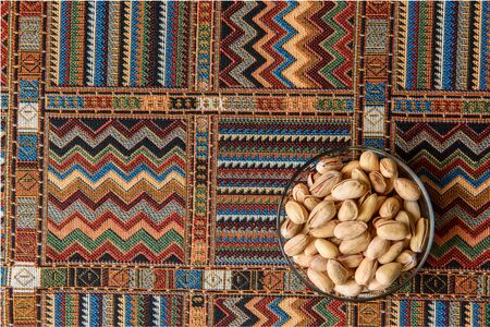 Pistachio Nuts on a traditional Arabian carpetの写真素材