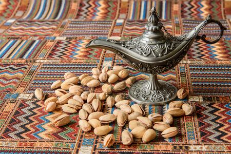 Pistachio Nuts on a traditional Arabian carpetの写真素材