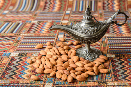 Nuts almonds on a traditional Arabian carpetの写真素材