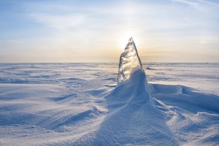 Blocks of ice gleaming in the sun, snow, frost, frozen water surface.の写真素材