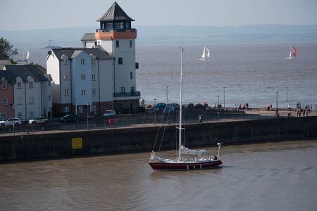 yachts returning to harbour at Portishead marinaの写真素材