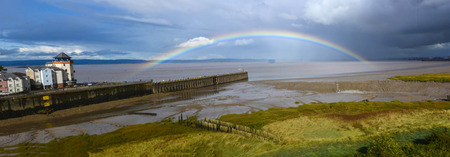 A rainbow arcs over the river Severn at Portisheadの写真素材