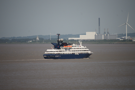 Cruise liner Corinthian passes Seabank Power Station on the river Severnのeditorial素材