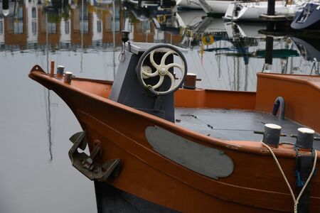 The bow of an old barge on a marina mooringの写真素材