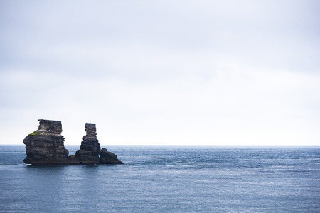 huge rock and island in the seaの写真素材