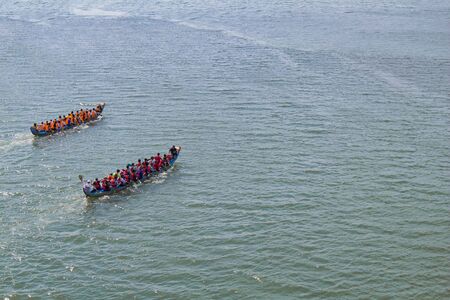 a dragon boat on the river and racing