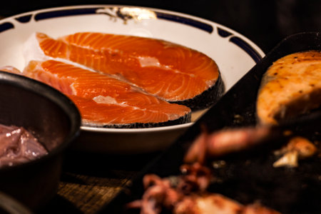 close-up of raw salmon on an iron plate