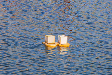 Water lanterns under the setting sunの写真素材