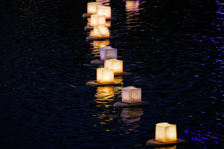 water lanterns float on the calm lakeの写真素材