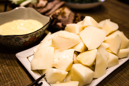 freshly sliced bamboo shoots accompanied by a yellow dressingの写真素材