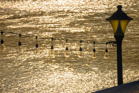 the lights by the harbor emit a warm glow in the night