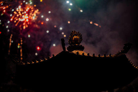 the roof of an ancient temple appears solemn and serene in the nightの写真素材