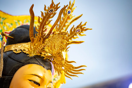 close-up of the elaborate and magnificent crown atop a goddess's headの写真素材