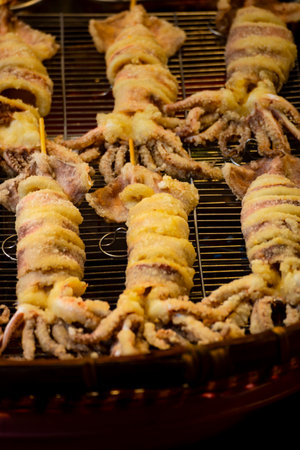 close-up of several deep-fried squid tubes