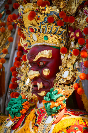 the ornate statue of General Shun Feng Er (Patron of Good Hearing)の写真素材