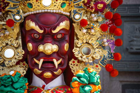 the ornate statue of General Shun Feng Er (Patron of Good Hearing)の写真素材