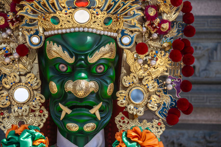the ornate statue of General Qian Li Yan (Thousand-Mile Eye), one of the two Divine Guardians of Mazu (Goddess of the Sea)の写真素材