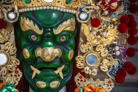 the ornate statue of General Qian Li Yan (Thousand-Mile Eye), one of the two Divine Guardians of Mazu (Goddess of the Sea)の写真素材