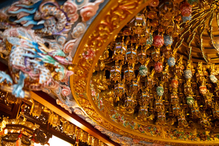 the ornate and complex ceiling structure known as the Caisson Ceiling (ZÇojÇng) in a traditional Asian templeの写真素材