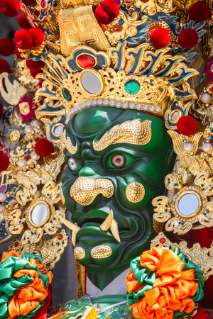 the ornate statue of General Qian Li Yan (Thousand-Mile Eye), one of the two Divine Guardians of Mazu (Goddess of the Sea)の写真素材