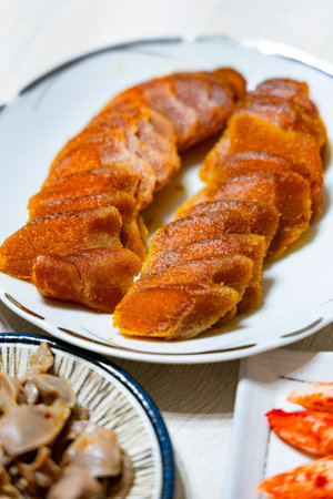 the mouth-watering texture of sliced mullet roe