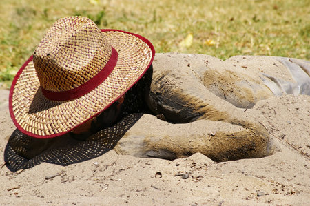 Man sunbathing on a beach.の写真素材