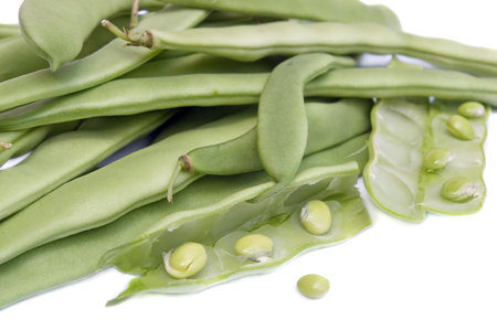 Green beans over white background.
