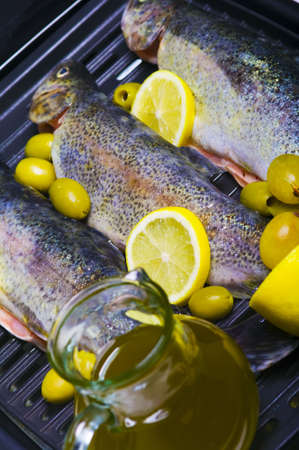 Trouts, olive, olive oil and lemon