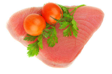 filet of tuna, parsley and cherry tomatoesの写真素材