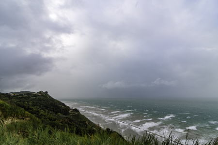 beach in the sea with blue water, plants, yellow sand and with a wonderful viewの写真素材