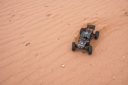 RC car buggy crowler Vaterra Twin Hammers driving through the sandのeditorial素材