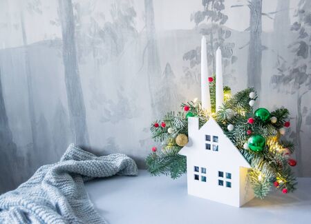 Christmas composition of fir branches with Christmas decorations, candles and garlands.の写真素材