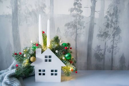 Christmas composition of fir branches with Christmas decorations, candles and garlands.の写真素材