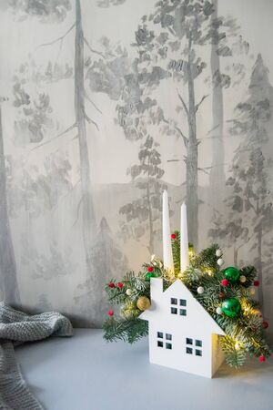 Christmas composition of fir branches with Christmas decorations, candles and garlands.の写真素材