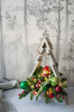 Christmas composition of fir branches with Christmas decorations and garlands.の写真素材