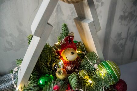 Christmas composition of fir branches with Christmas decorations and garlands.の写真素材