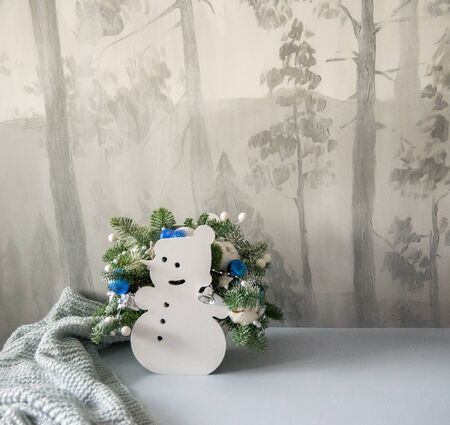 Christmas composition of fir branches with Christmas decorations and on a winter background.の写真素材
