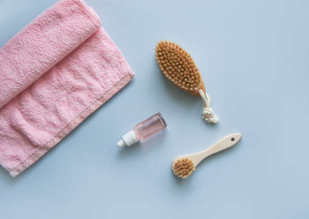 Massage brush for the body. Dry lymphatic drainage massage. Wooden brush made of cactus and boar fiber. Homemade body care.の写真素材