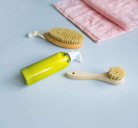 Massage brush for the body. Dry lymphatic drainage massage. Wooden brush made of cactus and boar fiber. Homemade body care.の写真素材