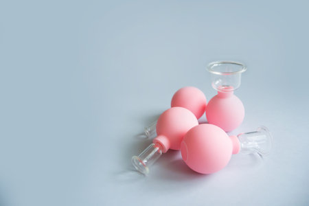 Vacuum cups of different sizes for lymphatic drainage facial massageの写真素材