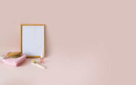 Attributes for massage and a towel, behind an empty wooden frame.の写真素材
