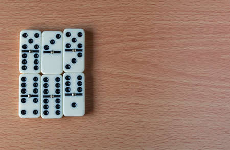 a bunch of domino blocks with numbers on a table, Selective focus, Selective focus on subject,...