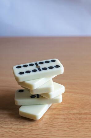 a bunch of domino blocks with numbers on a table, Selective focus, Selective focus on subject, background blurの写真素材