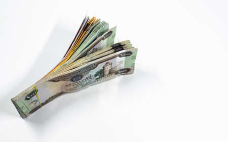 A close up view of United Arab Emirates currency, with white background, UAE Dirhams