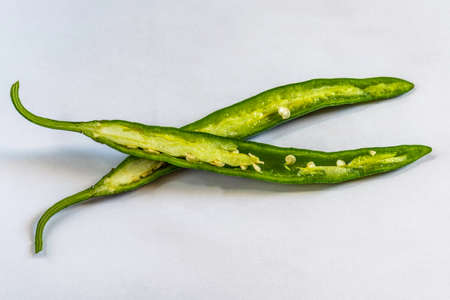 Cut green chili on a nice white backgound,  Selective focus, Selective focus on subject, background...