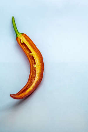 a big red chilli in white background, Selective focus, Selective focus on subject, background blurの写真素材